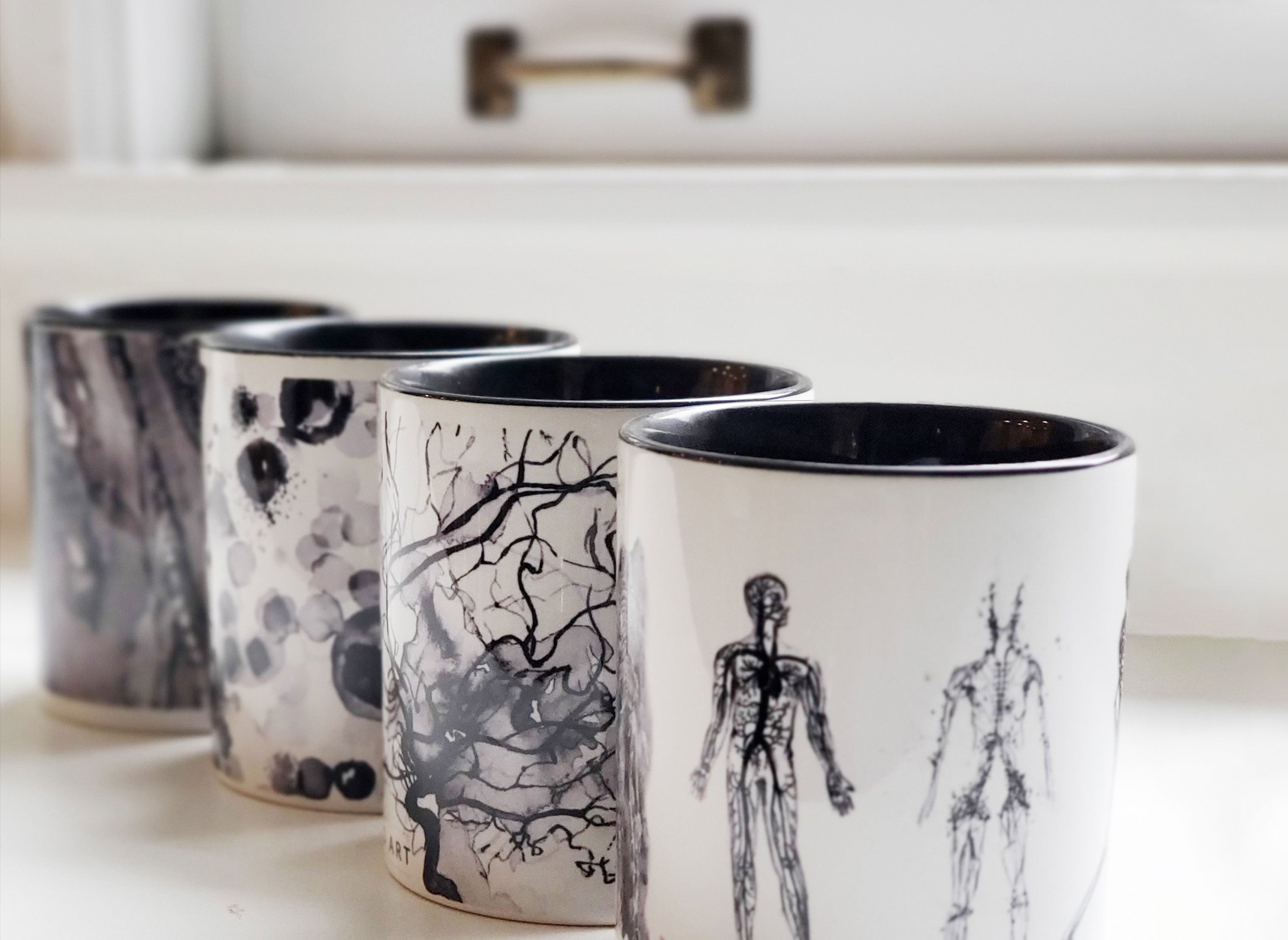 Travel coffee tumbler with anatomy inspired eye art. 