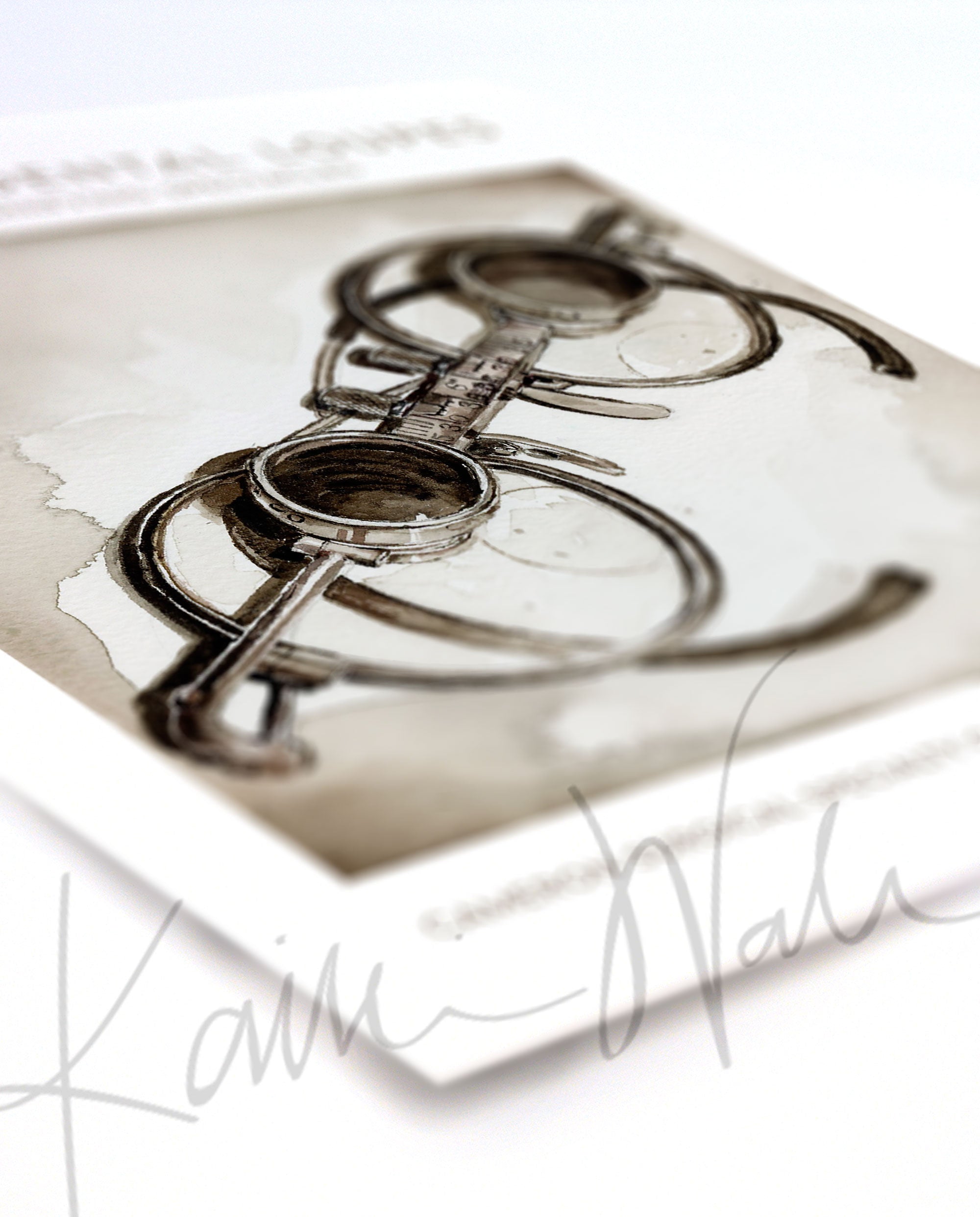 Angled view of a watercolor painting of antique style dental loupes.