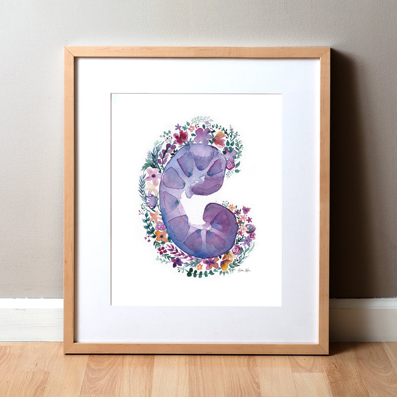 Framed artwork of a purple kidney surrounded by flowers on a white background.