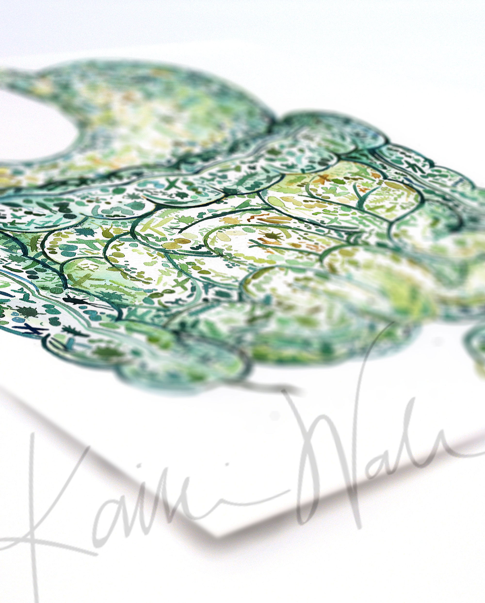 Angled view of a watercolor painting of the stomach and intestines showing the internal gut microbiome.