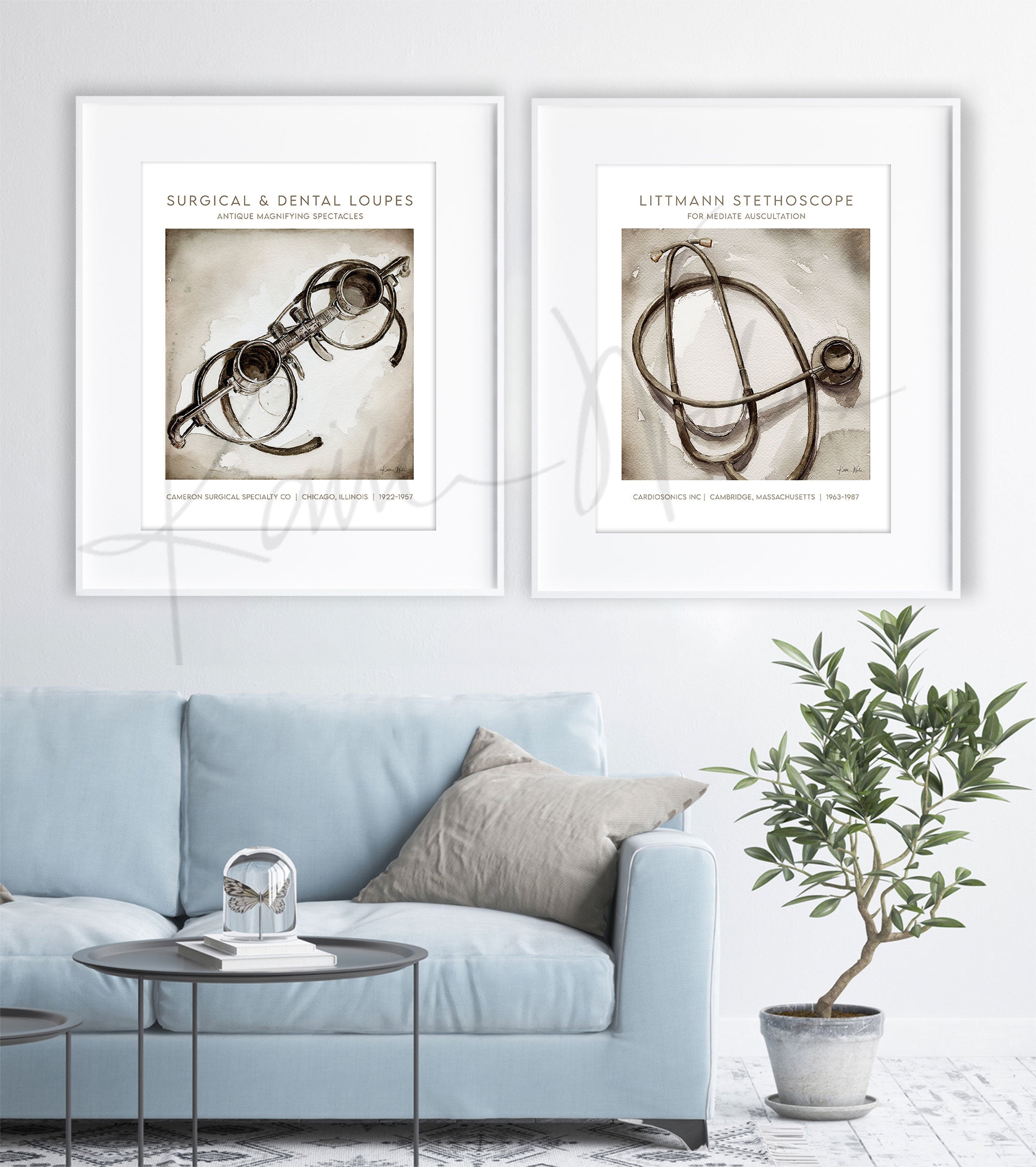 Framed watercolor painting set of a Littmann stethoscope and antique dental loupes. The painting is hanging over a blue couch.