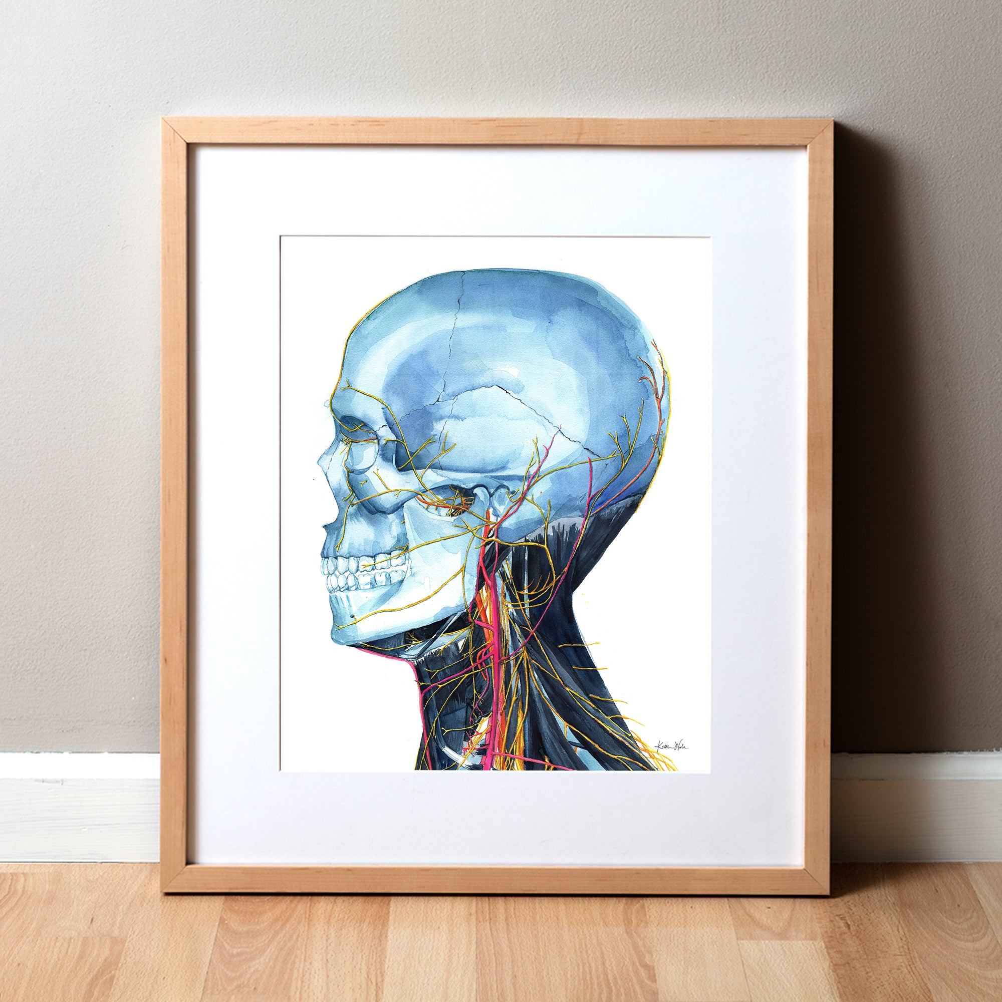 A framed anatomy art watercolor print of a skull and neck anatomy, with colorful veins, arteries, and nerves on a white background, displayed against a plain background.