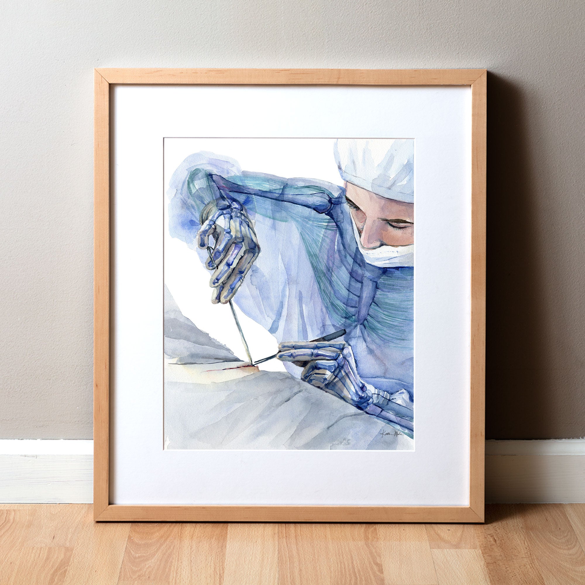 Framed watercolor painting showing the ergonomics of a surgeon at work.