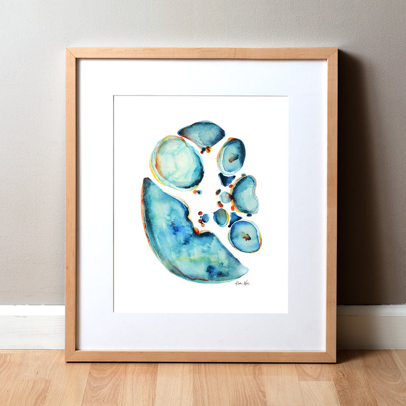 Framed watercolor anatomy art painting showing a cross section of an abdomen in blues and teals with pops of orange and yellow. Art for general surgeons