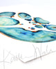 Watercolor painting showing a cross section of an abdomen in blues and teals with pops of orange and yellow. The painting is at an angle.