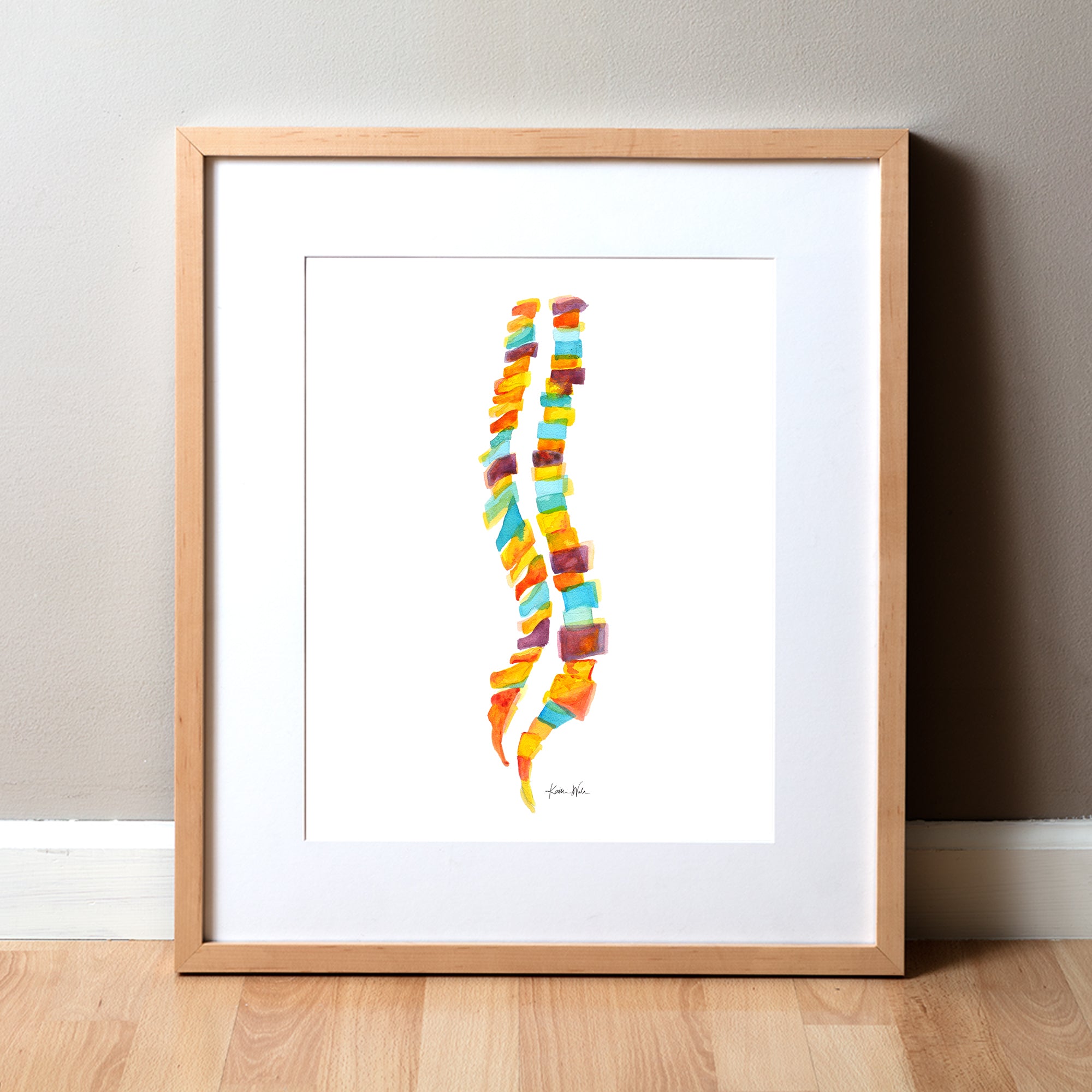 Framed watercolor painting of a spinal columns in yellow, orange, burgundy and teal.