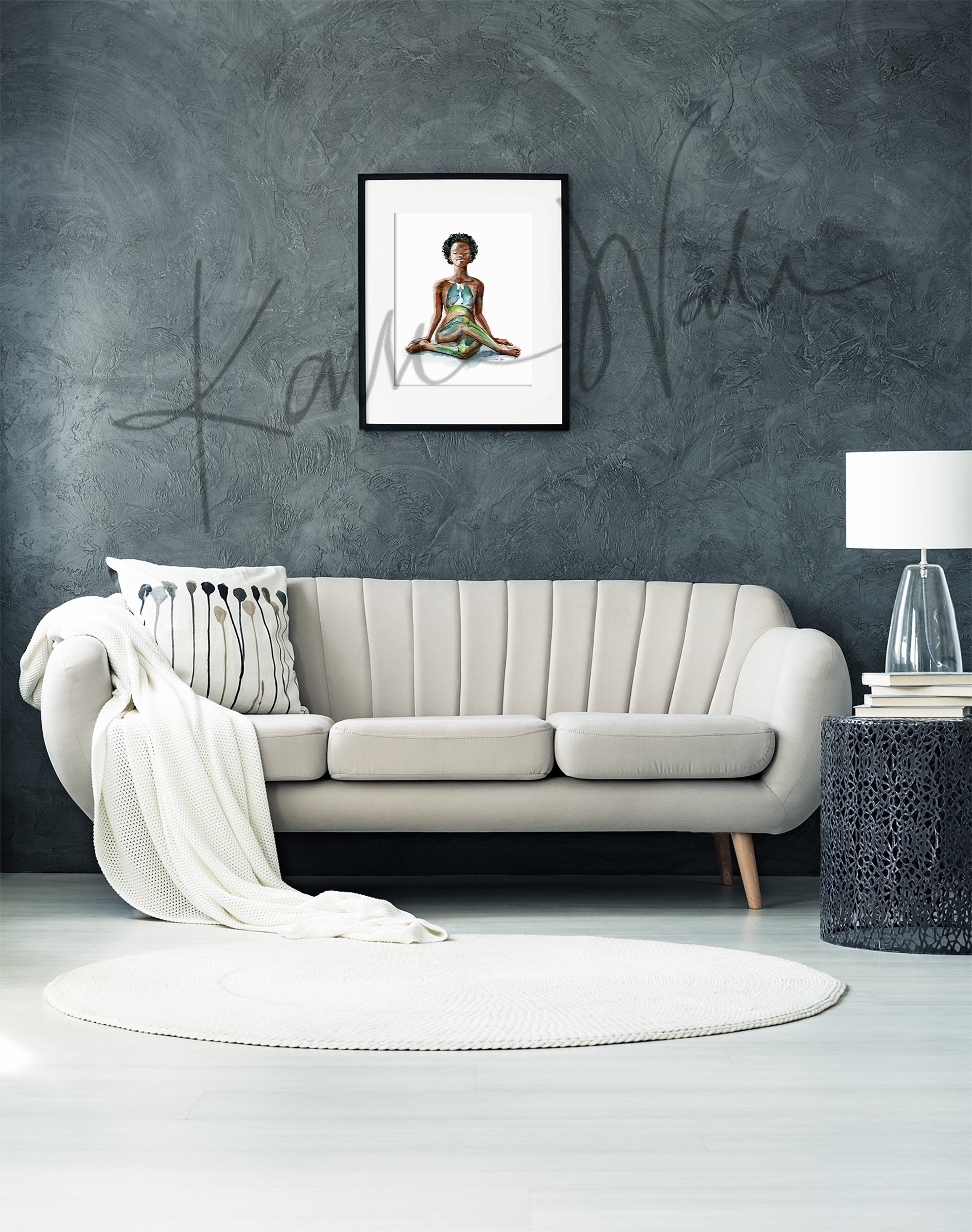 Framed watercolor painting of a black woman in a seated yoga pose with her eyes closed. The painting is hanging over white couch.