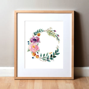 Framed watercolor painting of a flower wreath.