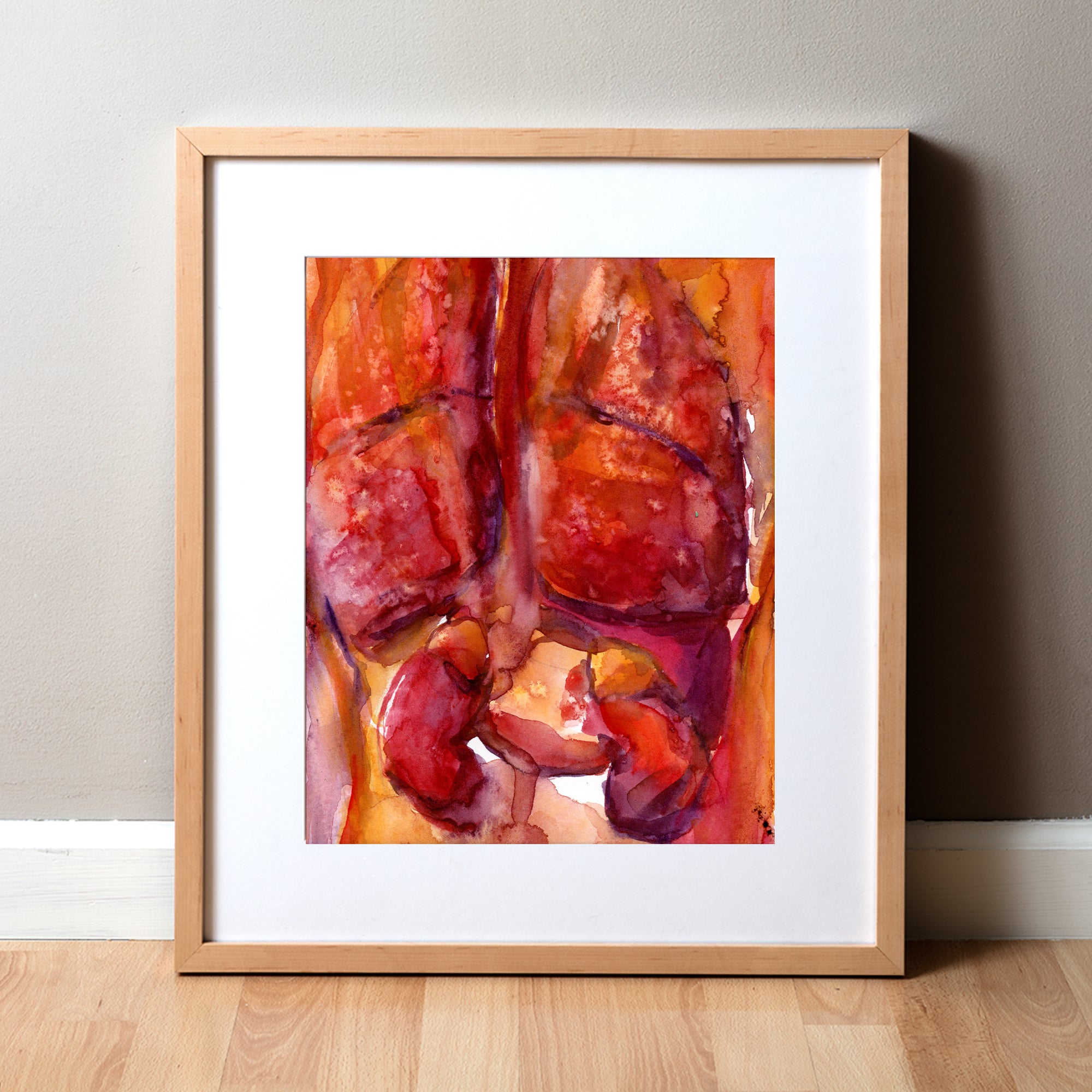Framed watercolor painting of the internal trunk organs in reds and oranges.
