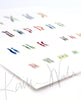 Angled view of a watercolor painting of the karyotype of someone with Down Syndrome.