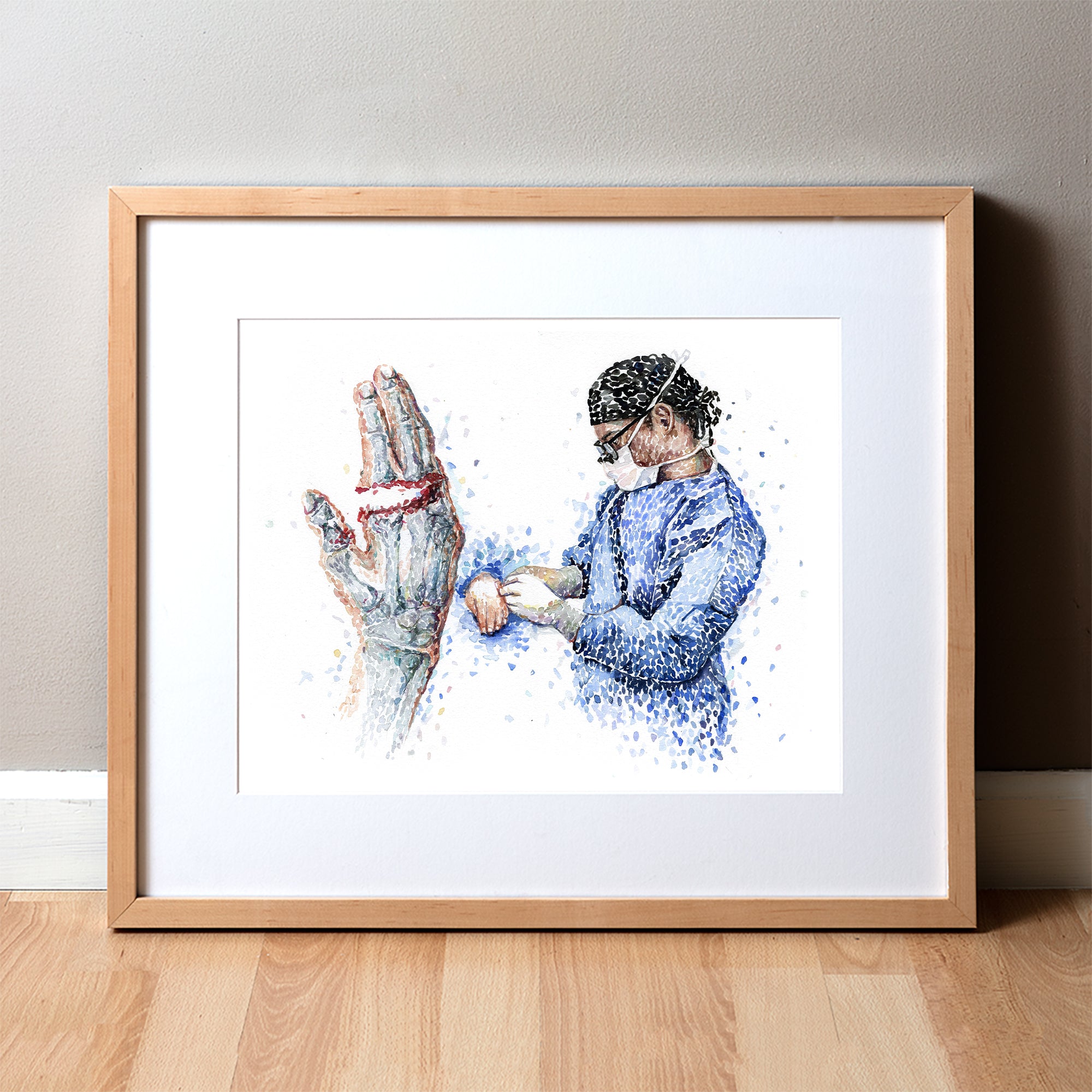 Framed watercolor painting of a finger amputation surgery.