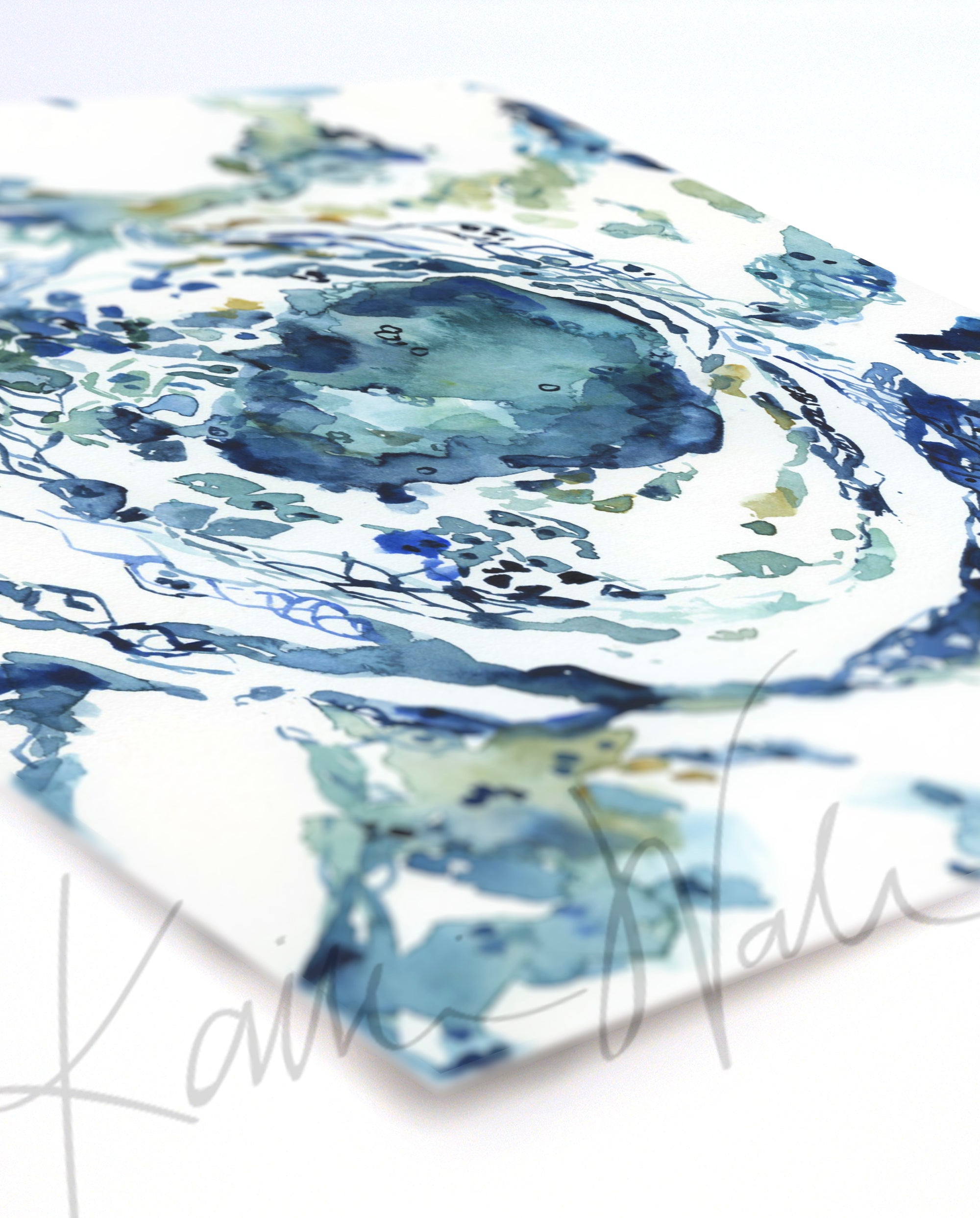 Unframed watercolor painting at an angle of a granuloma histology in blues and greens.