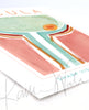 View of a contemporary poster design of the macula in pale green, teal, pink, red, and orange. The painting is at an angle.