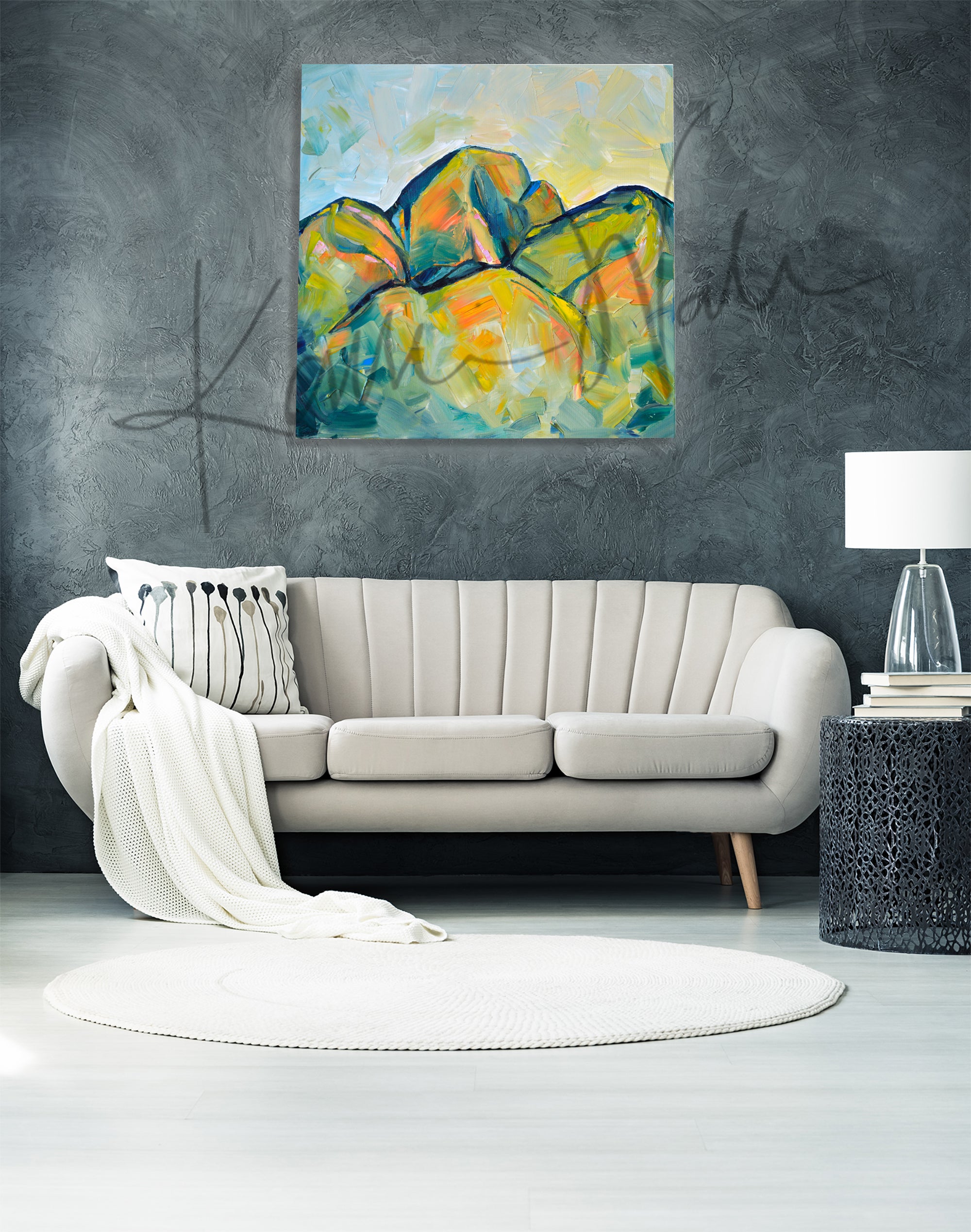 Oil painting of an abstract molar tooth painted to look like mountains. The painting is hanging over a beige couch.