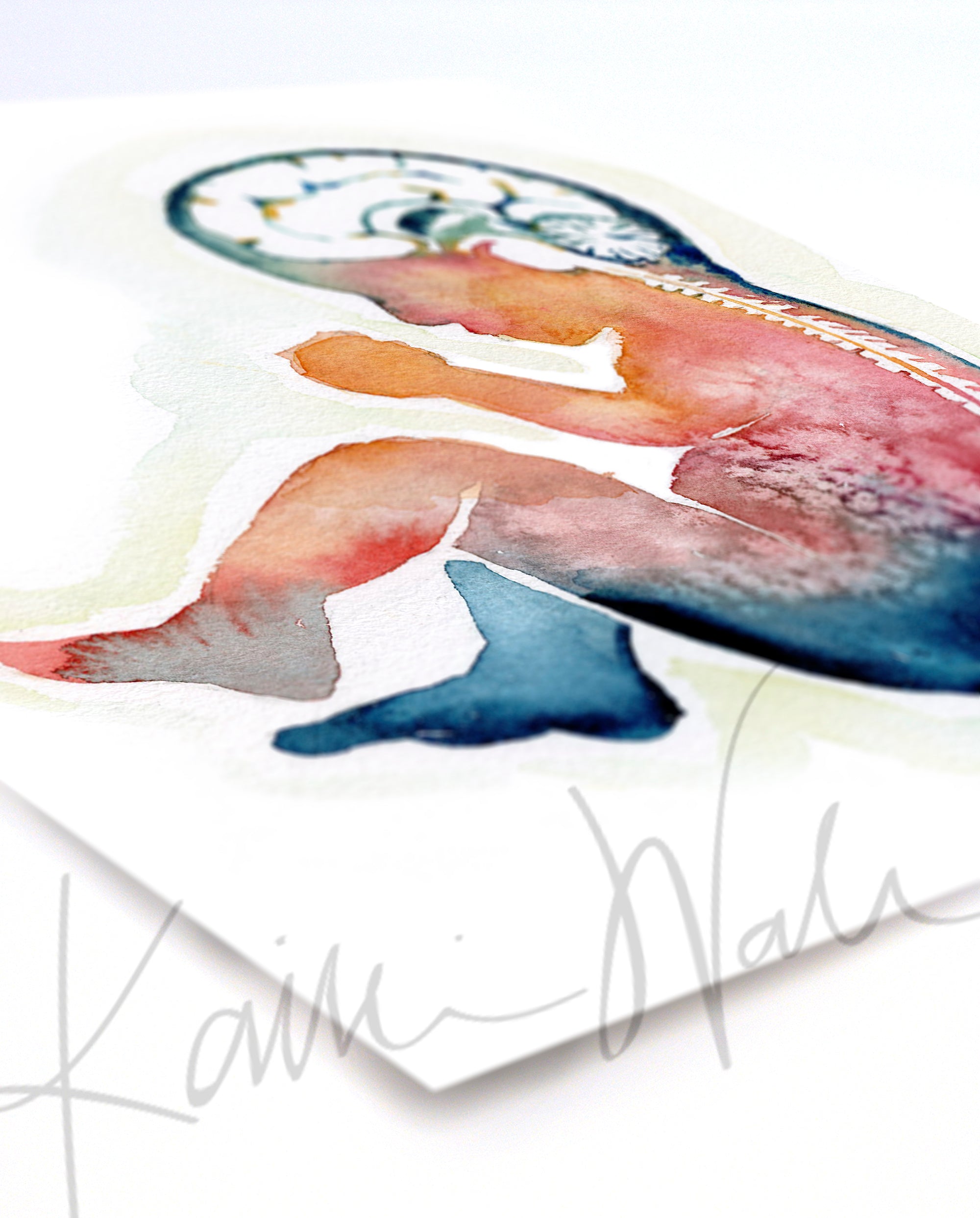 Unframed watercolor painting of a fetus showing the spine and brain in rainbow colors. The print is at an angle.