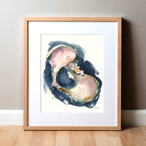 Framed watercolor painting showing a pelvis at an angle in purples, greens, browns, and navy blues.