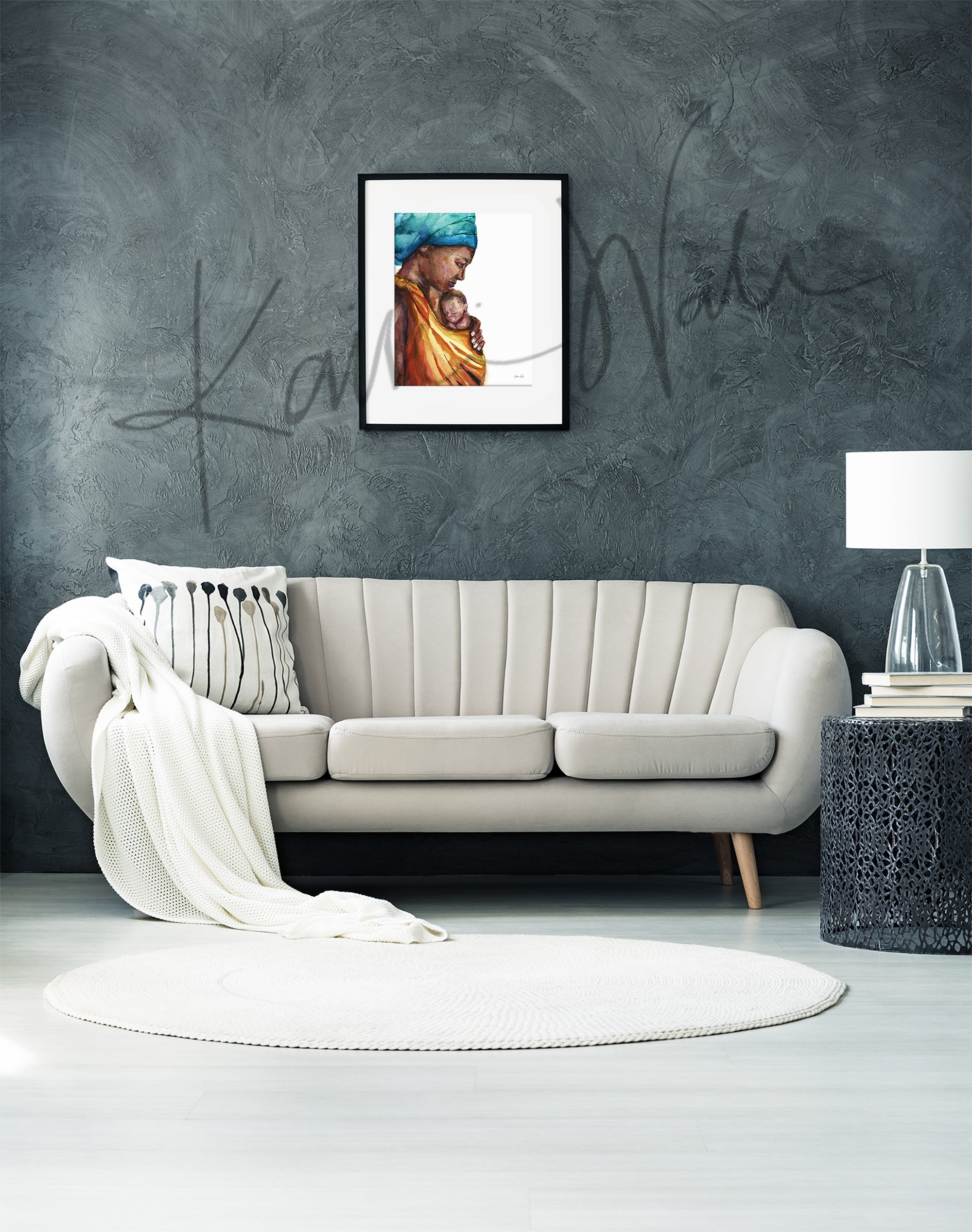 Framed watercolor painting of an african woman holding her premature infant. The painting is hanging over a beige couch.