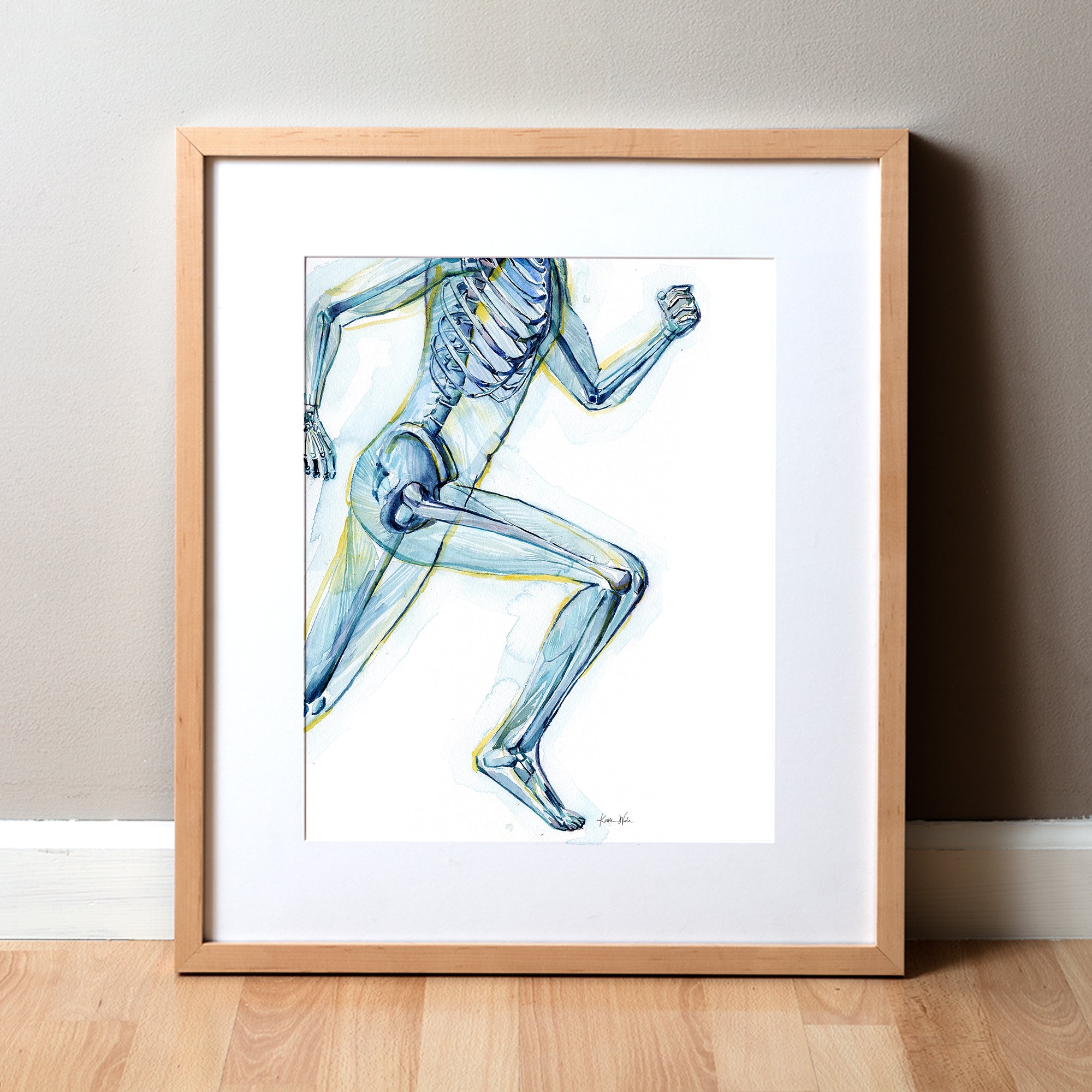 Framed watercolor painting of a runner, showing the skeletal structure beneath.