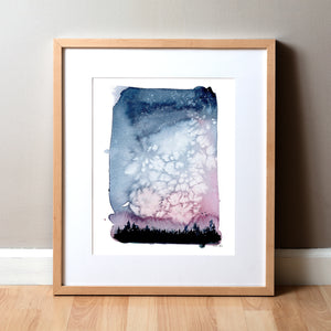 Framed watercolor painting of a beautiful night sky with silhouetted trees.