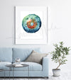 Framed watercolor painting of a regulatory T cell. The painting is hanging over a blue couch.