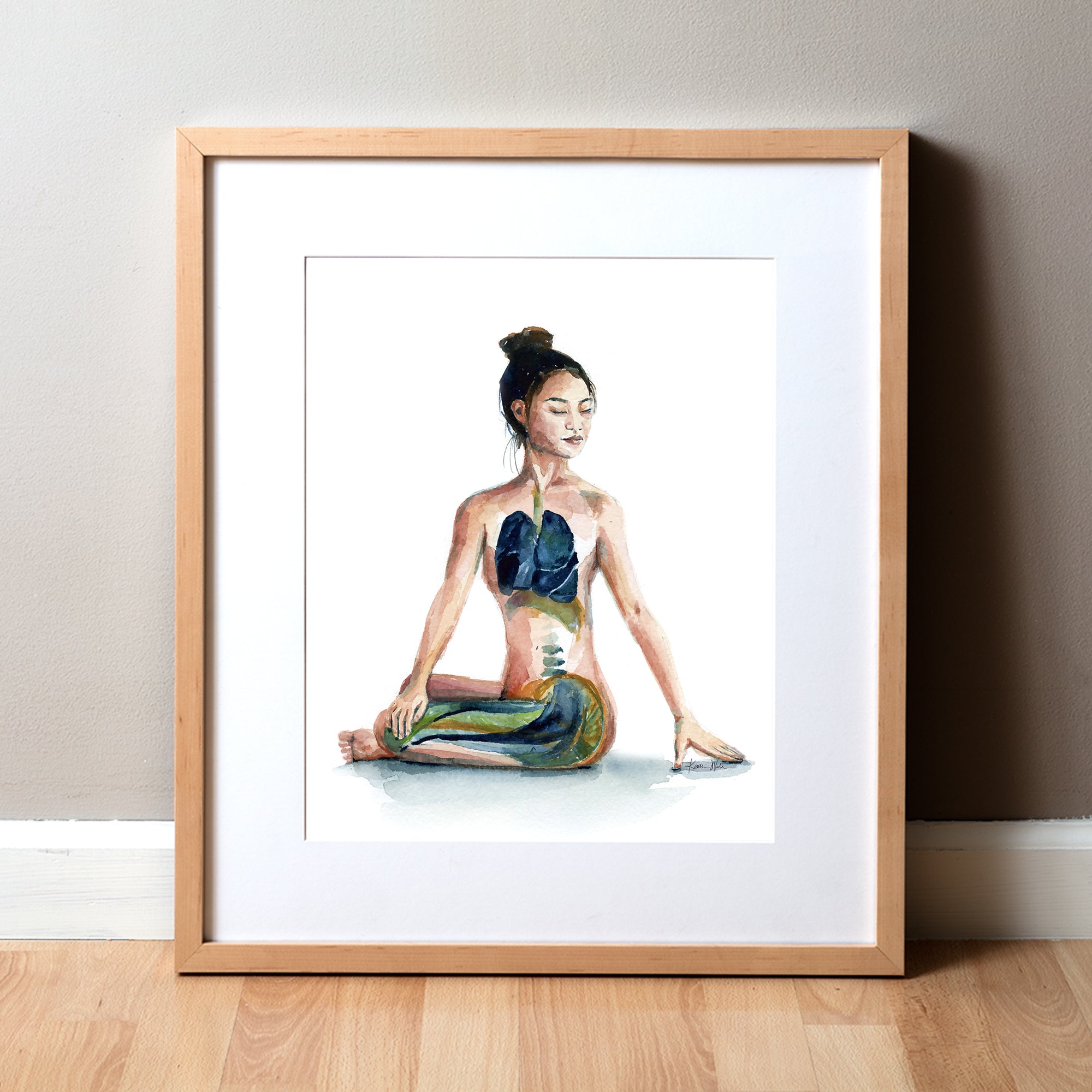 Framed watercolor painting of a woman with her eyes closed in a seated yoga pose.