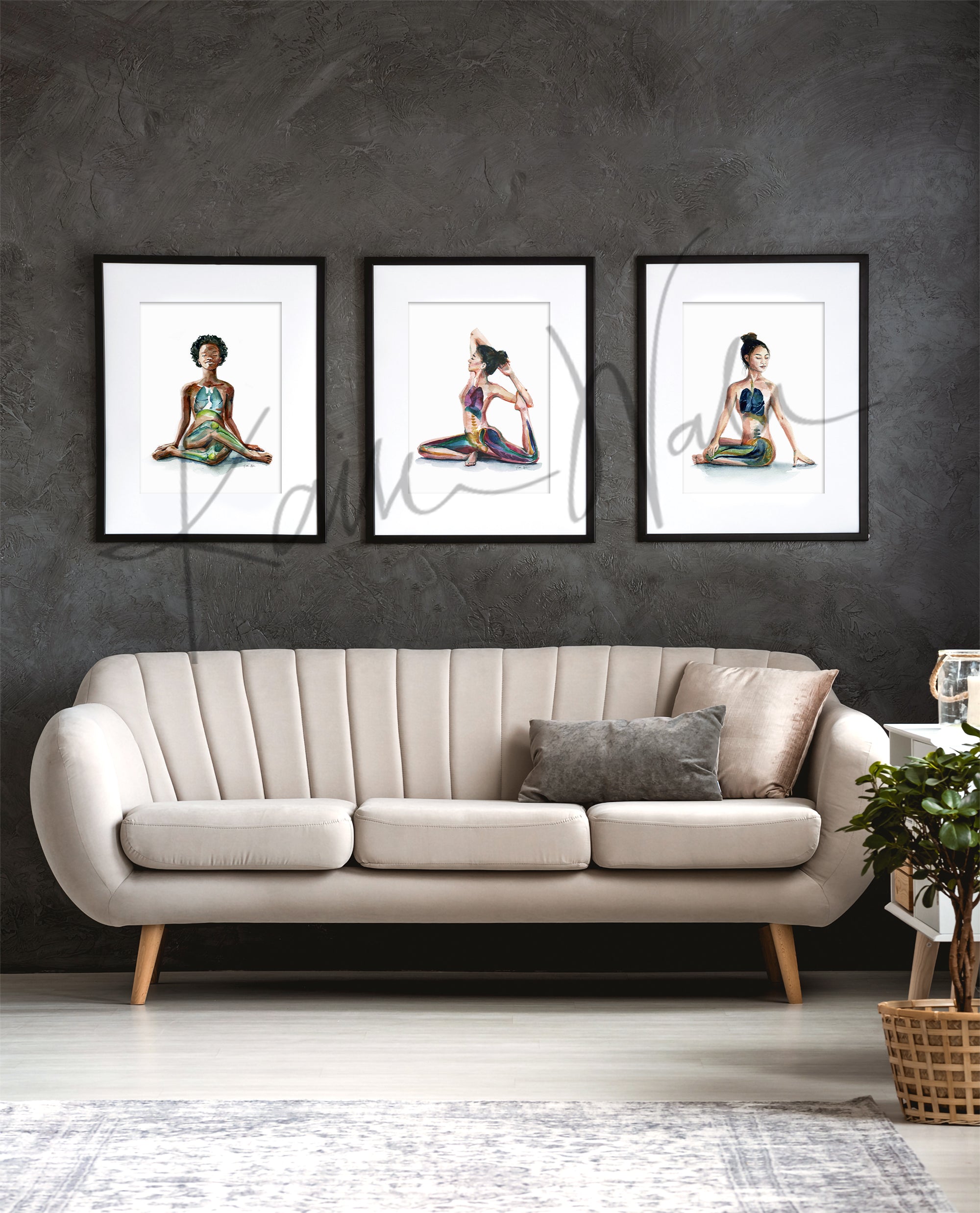 Framed watercolor painting set of 3 seated yoga poses. The painting is hanging over a white couch. 