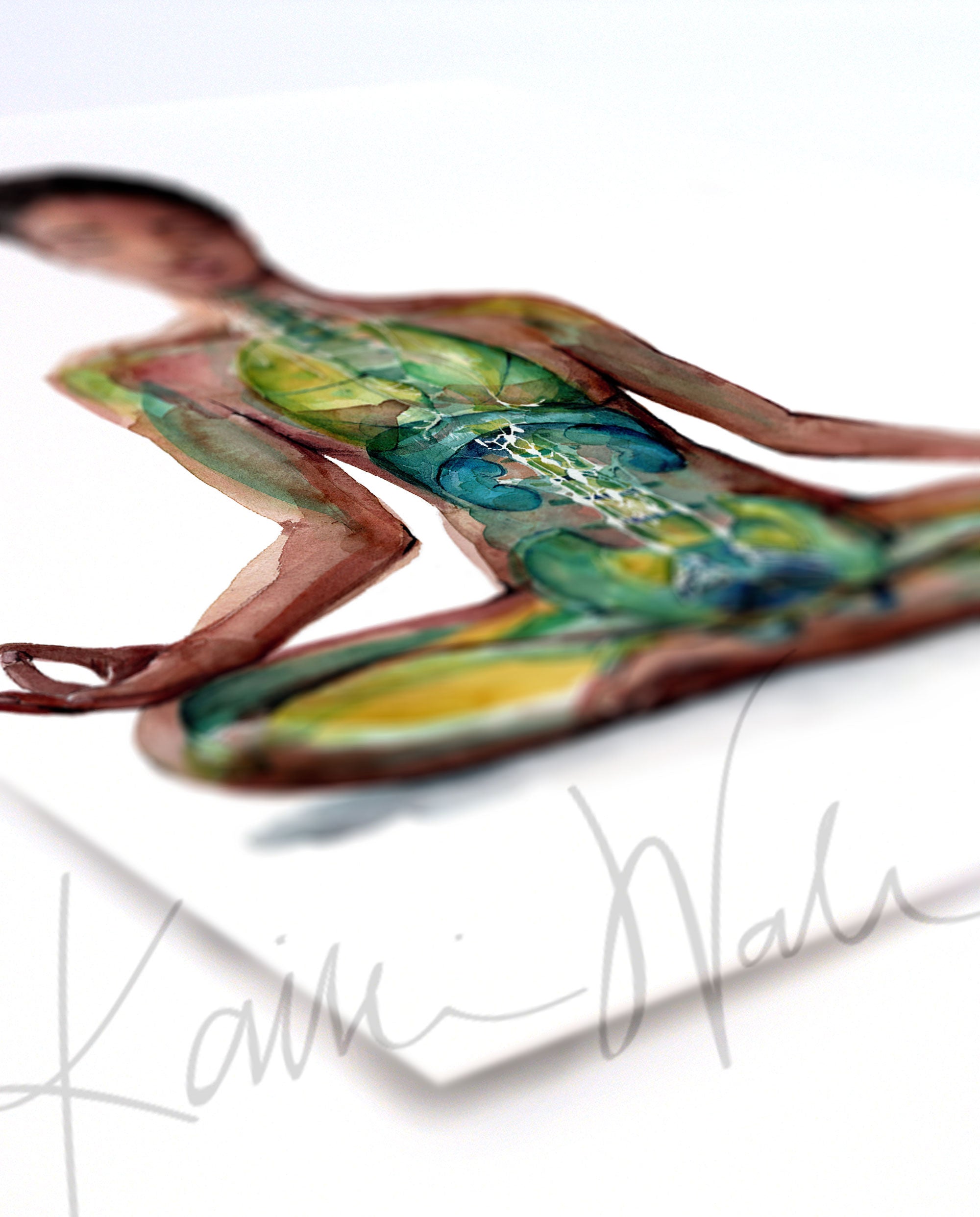 Angled view of a watercolor painting of a woman of color in a peaceful yoga pose.